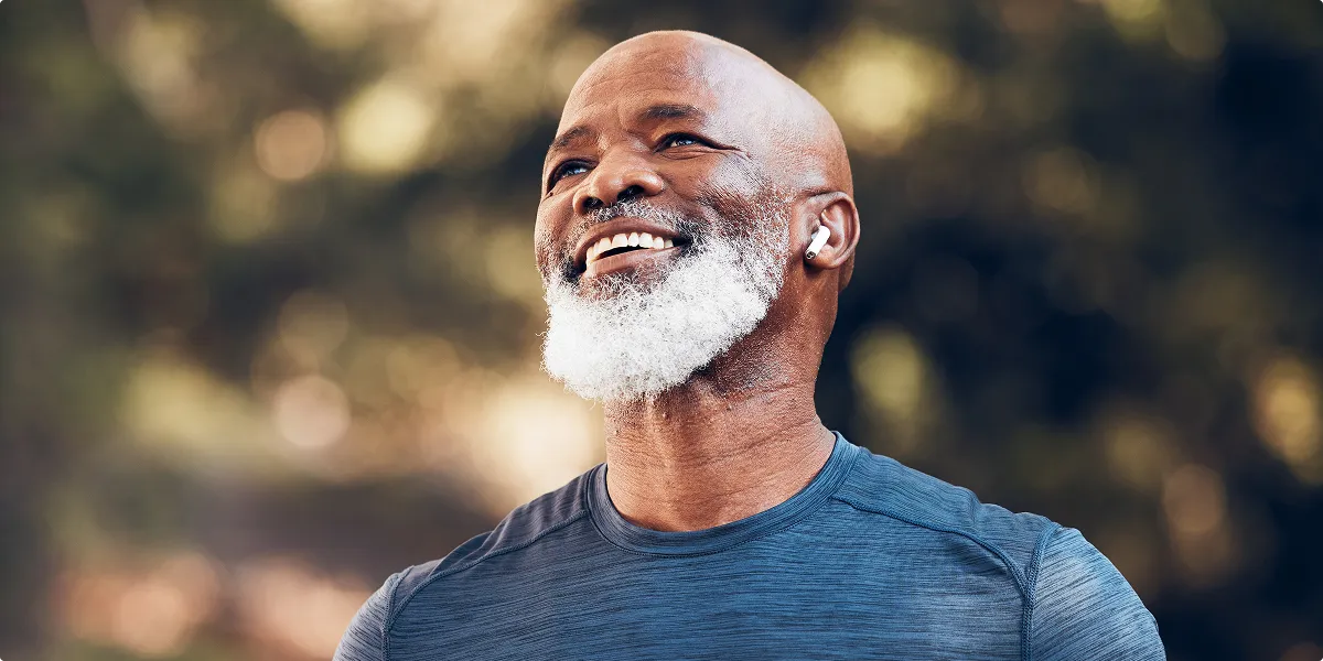 Smiling older man representing the benefits of peptide therapy for healthy aging
