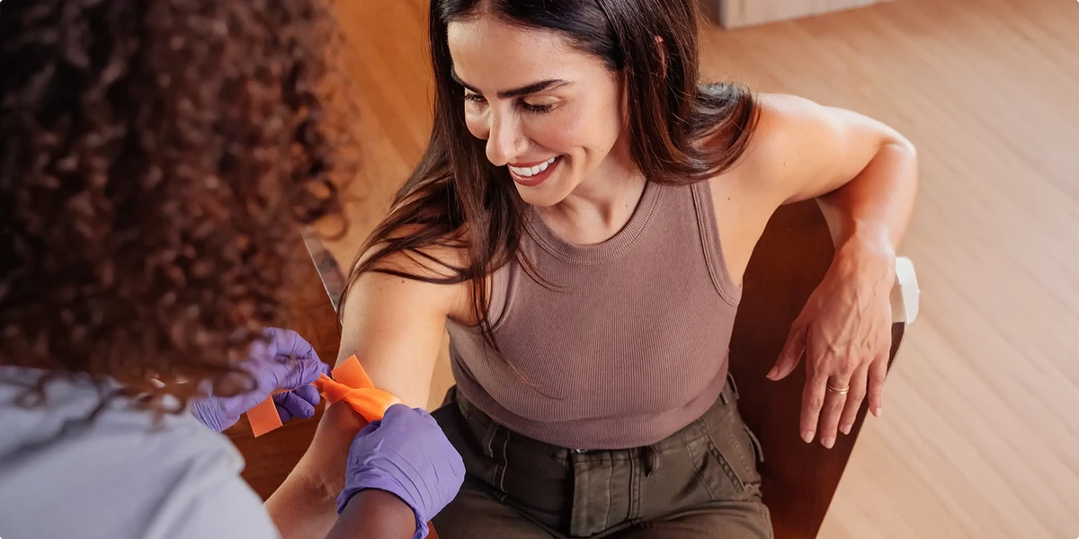 Patient receiving NAD IV therapy infusion for energy, recovery, and longevity treatment in a clinical setting